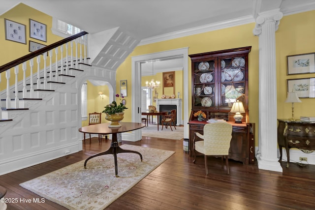 415 S 3rd St, Wilmington, NC 28401 - entryway featuring decorative columns, dark wood finished floors, stairs, arched walkways, and crown molding