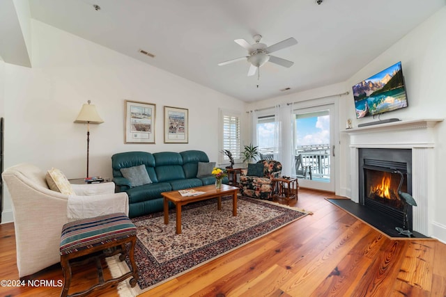 300 Midyette St Unit A15, Oriental, NC 28571 - living room with wood finished floors, a ceiling fan, and a fireplace with flush hearth