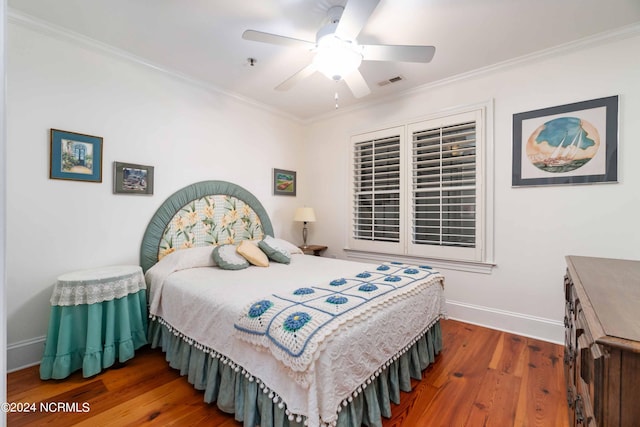 300 Midyette St Unit A15, Oriental, NC 28571 - bedroom featuring wood finished floors, ornamental molding, and a ceiling fan