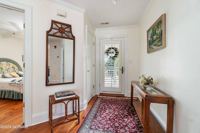 300 Midyette St Unit A15, Oriental, NC 28571 - doorway to outside featuring light wood-style floors and ornamental molding