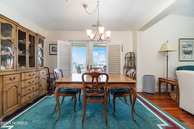 300 Midyette St Unit A15, Oriental, NC 28571 - dining space featuring a chandelier and wood finished floors