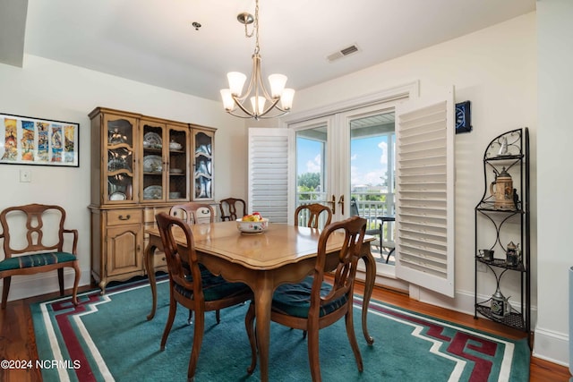 300 Midyette St Unit A15, Oriental, NC 28571 - dining room with a chandelier, dark wood-style floors, and french doors