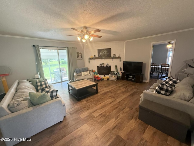 347 Forest Knolls Rd, Goldsboro, NC 27534 - living room featuring ornamental molding, a textured ceiling, a ceiling fan, and wood finished floors