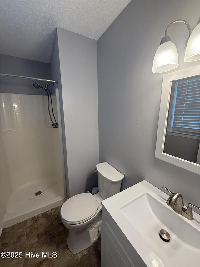 347 Forest Knolls Rd, Goldsboro, NC 27534 - bathroom featuring a shower, vanity, and a textured ceiling