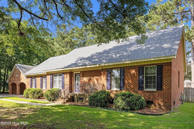 212 Evanswood Dr, Greenville, NC 27858 - view of front of home featuring roof with shingles, a front lawn, brick siding, and a detached garage