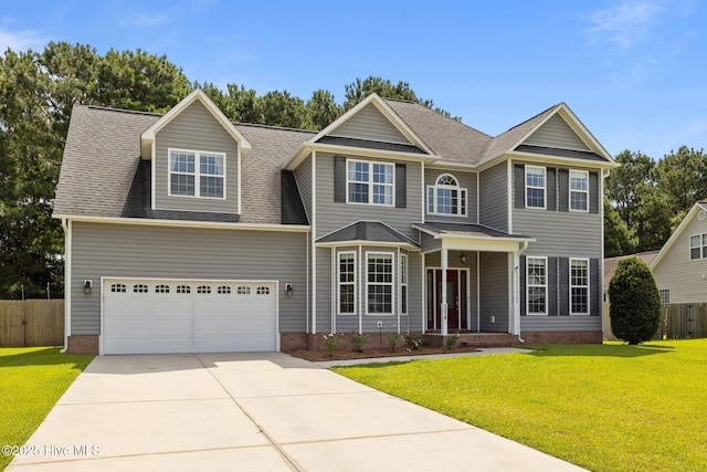 324 Foster Creek Rd, Swansboro, NC 28584 - view of front of home featuring concrete driveway, a garage, roof with shingles, and covered porch