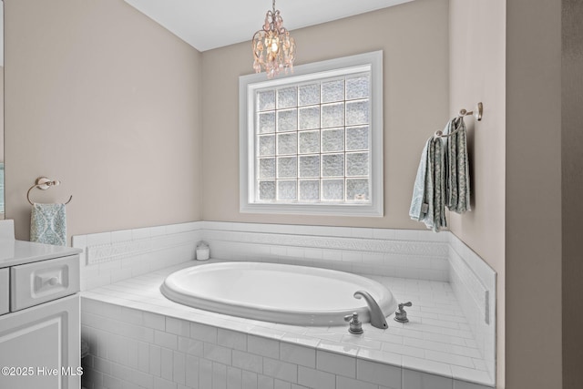 324 Foster Creek Rd, Swansboro, NC 28584 - bathroom featuring a garden tub, vanity, and a chandelier