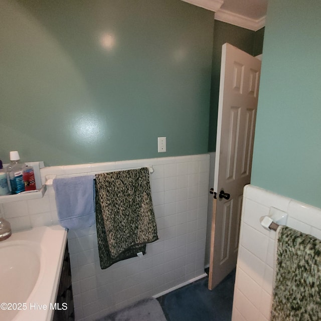 204 Tyree Rd, Kinston, NC 28504 - bathroom with tile walls, wainscoting, vanity, and ornamental molding
