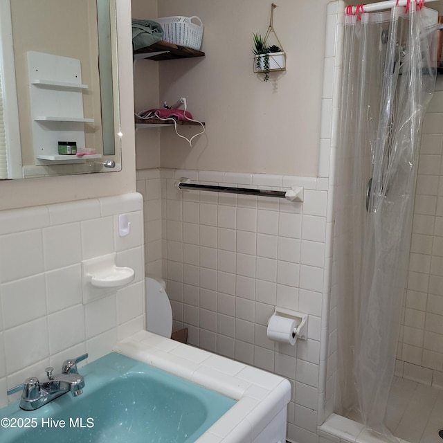 204 Tyree Rd, Kinston, NC 28504 - full bath with tile walls, tiled shower, and wainscoting
