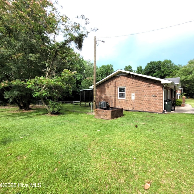 204 Tyree Rd, Kinston, NC 28504 - view of side of home featuring brick siding and a central AC unit