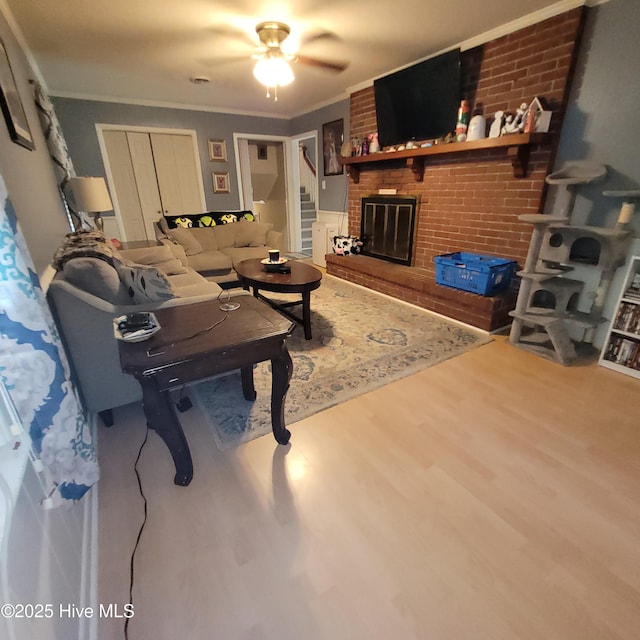 204 Tyree Rd, Kinston, NC 28504 - living area featuring wood finished floors, a ceiling fan, crown molding, and a brick fireplace