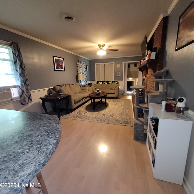 204 Tyree Rd, Kinston, NC 28504 - living area with light wood-style floors, ornamental molding, and ceiling fan