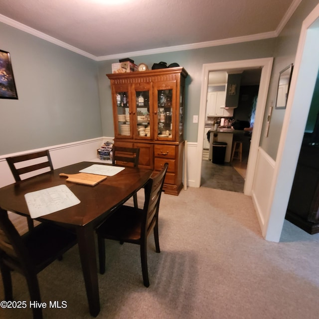204 Tyree Rd, Kinston, NC 28504 - dining room with wainscoting, crown molding, and light carpet