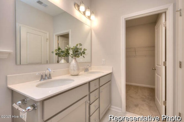 120 Forest Walk SW Unit 73, Sunset Beach, NC 28468 - full bathroom with double vanity and a spacious closet