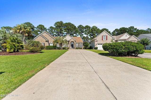 923 Meadowlands Trl, Calabash, NC 28467 - traditional home with concrete driveway and a front yard