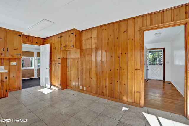 377 Louis Breeden Blvd, Hamlet, NC 28345 - tiled empty room with wooden walls and baseboards