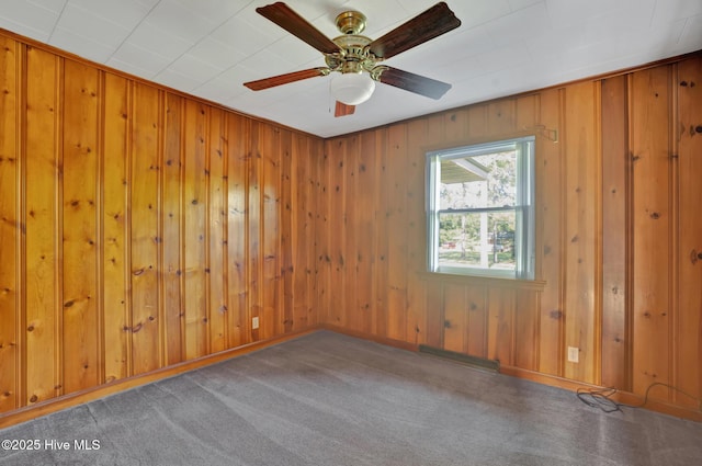 377 Louis Breeden Blvd, Hamlet, NC 28345 - unfurnished room with wood walls and ceiling fan