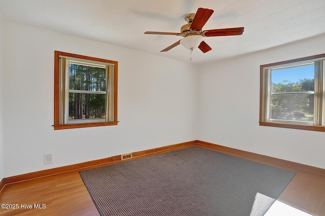 377 Louis Breeden Blvd, Hamlet, NC 28345 - unfurnished room with wood finished floors and ceiling fan