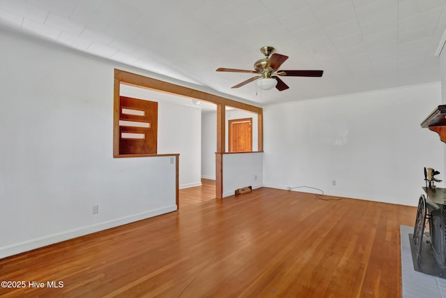 377 Louis Breeden Blvd, Hamlet, NC 28345 - unfurnished living room with ceiling fan and wood finished floors