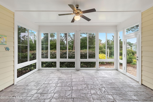 2955 Moorings Way SE, Southport, NC 28461 - unfurnished sunroom featuring a ceiling fan and wood walls