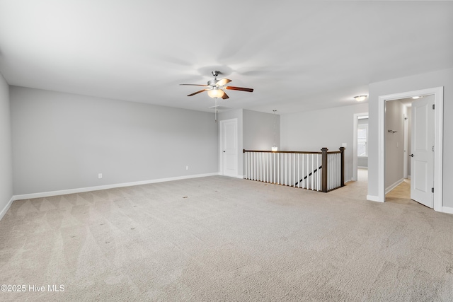 2955 Moorings Way SE, Southport, NC 28461 - empty room with ceiling fan and light colored carpet