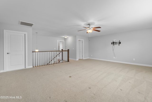 2955 Moorings Way SE, Southport, NC 28461 - spare room with ceiling fan and light colored carpet