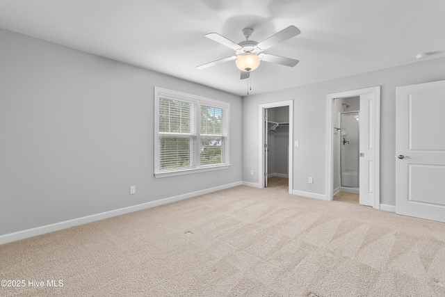 2955 Moorings Way SE, Southport, NC 28461 - unfurnished bedroom with a walk in closet, carpet flooring, a closet, and ensuite bathroom