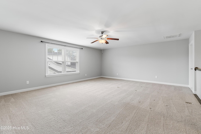 2955 Moorings Way SE, Southport, NC 28461 - empty room featuring a ceiling fan and light carpet