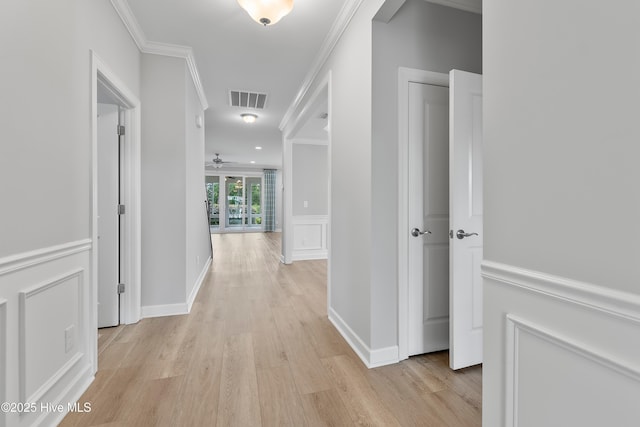 2955 Moorings Way SE, Southport, NC 28461 - corridor with light wood-style floors and ornamental molding