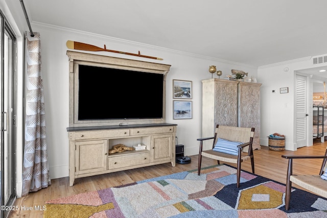 8801 Reed Dr Unit 303W, Emerald Isle, NC 28594 - living room with ornamental molding and light wood finished floors