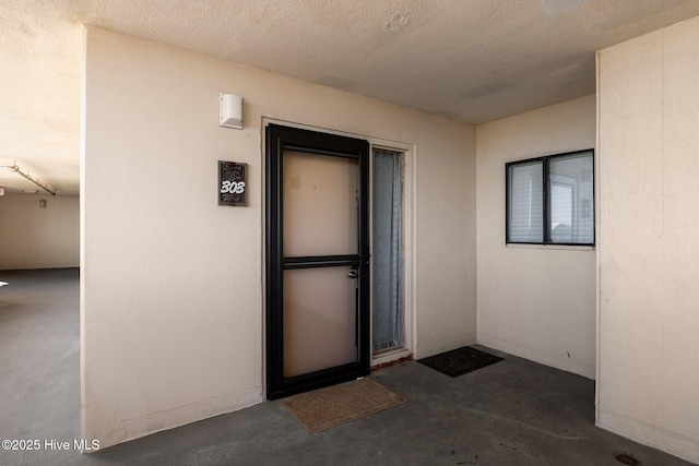 8801 Reed Dr Unit 303W, Emerald Isle, NC 28594 - property entrance with stucco siding