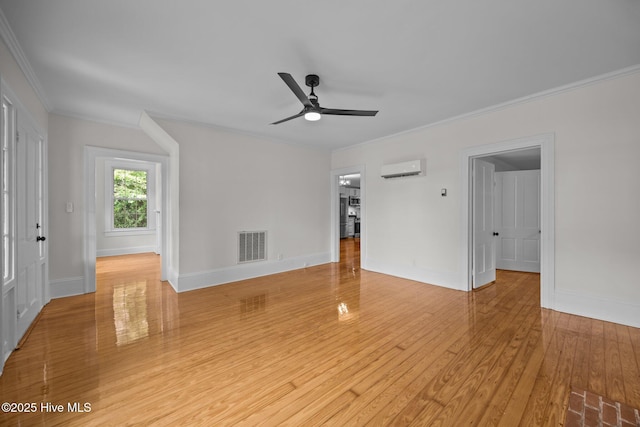 25967 US-264, Pantego, NC 27860 - unfurnished living room with ornamental molding, ceiling fan, light wood finished floors, and a wall unit AC
