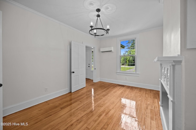 25967 US-264, Pantego, NC 27860 - unfurnished dining area with a wall mounted air conditioner, a chandelier, crown molding, and light wood finished floors