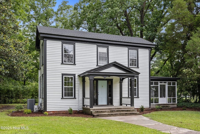 25967 US-264, Pantego, NC 27860 - view of front facade featuring a front lawn, a sunroom, and a shingled roof