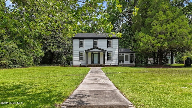 25967 US-264, Pantego, NC 27860 - colonial home with a front yard and a sunroom