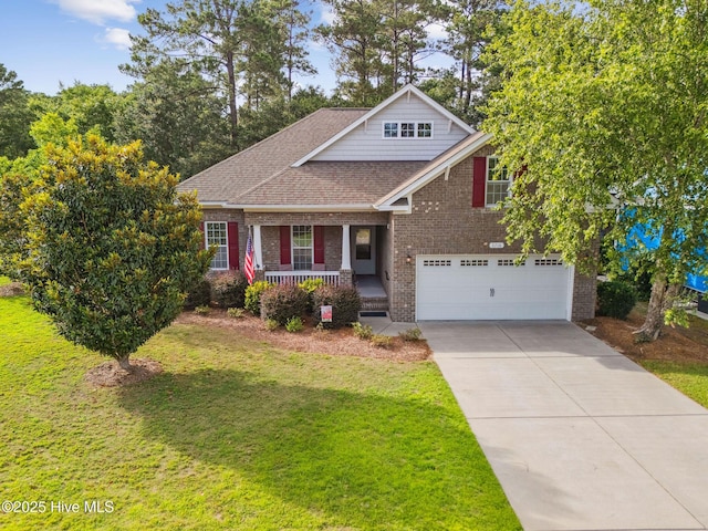 3716 Pond Pine Ct, Southport, NC 28461 - view of front of property featuring a porch, brick siding, an attached garage, driveway, and a front lawn