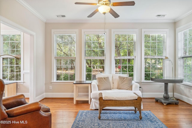 3716 Pond Pine Ct, Southport, NC 28461 - sunroom / solarium with healthy amount of natural light, wood finished floors, and crown molding