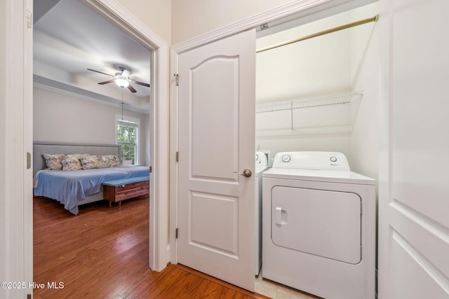3716 Pond Pine Ct, Southport, NC 28461 - laundry area with a ceiling fan, light wood-style flooring, and separate washer and dryer