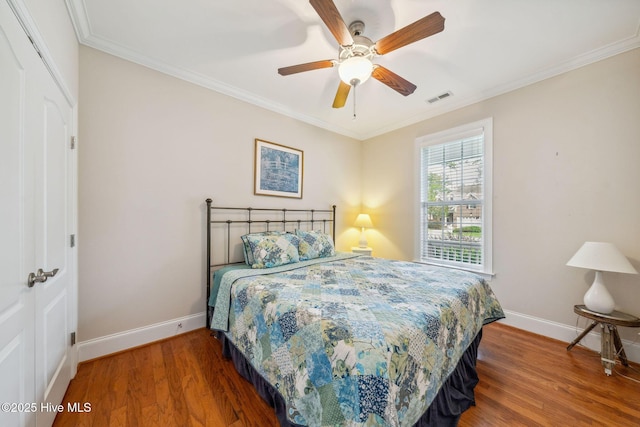 3716 Pond Pine Ct, Southport, NC 28461 - bedroom with wood finished floors, crown molding, and a ceiling fan