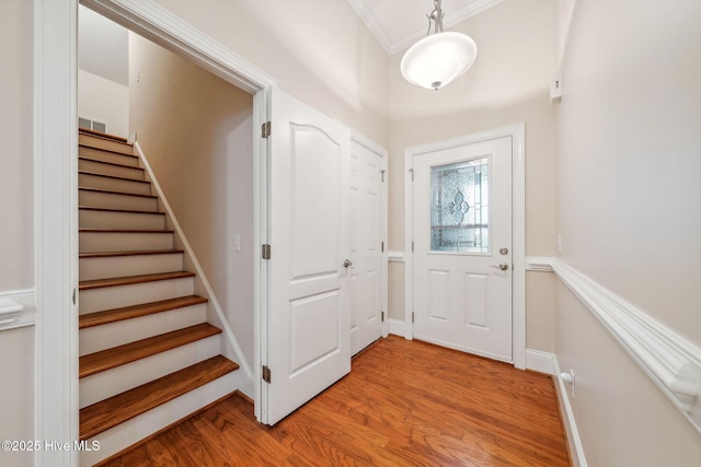 3716 Pond Pine Ct, Southport, NC 28461 - foyer entrance with stairs and light wood-style floors