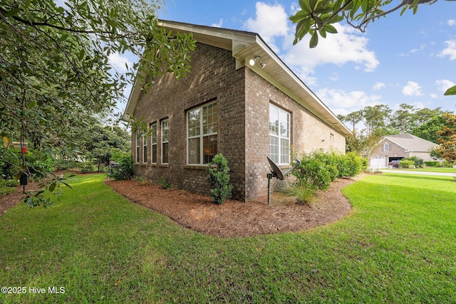 3716 Pond Pine Ct, Southport, NC 28461 - view of side of property with brick siding and a yard