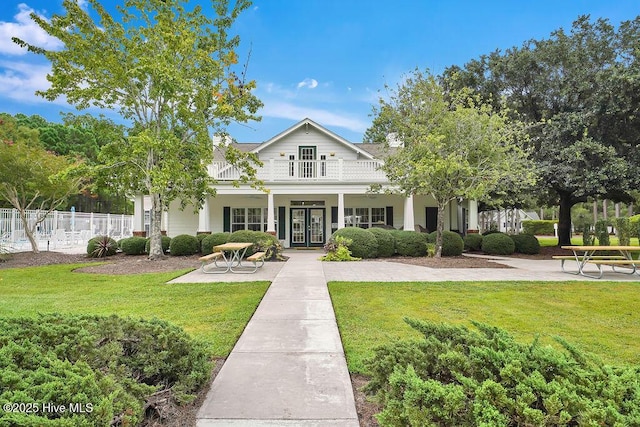 3716 Pond Pine Ct, Southport, NC 28461 - view of front of house featuring french doors and a balcony