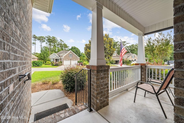 3716 Pond Pine Ct, Southport, NC 28461 - covered porch featuring a residential view