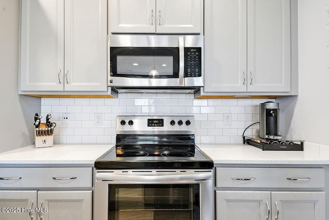 1022 Summer Woods Dr, Wilmington, NC 28412 - kitchen featuring appliances with stainless steel finishes and backsplash