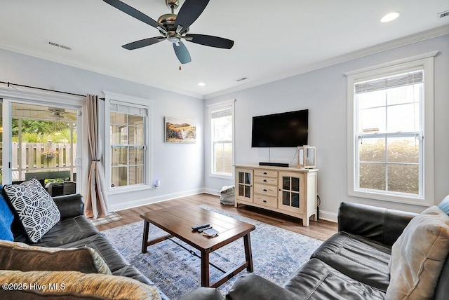 1022 Summer Woods Dr, Wilmington, NC 28412 - living area with a ceiling fan, healthy amount of natural light, crown molding, wood finished floors, and recessed lighting