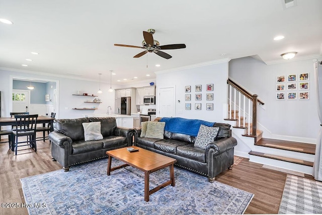 1022 Summer Woods Dr, Wilmington, NC 28412 - living area with a ceiling fan, light wood-type flooring, stairs, recessed lighting, and ornamental molding