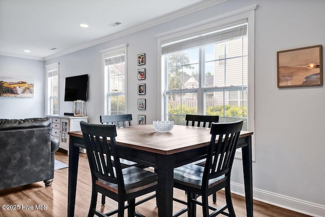 1022 Summer Woods Dr, Wilmington, NC 28412 - dining area featuring ornamental molding, wood finished floors, and recessed lighting