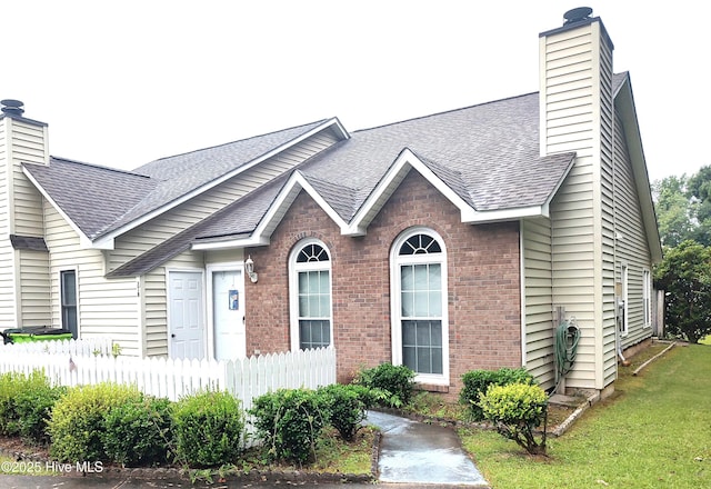 31 Mulberry Ln, New Bern, NC 28562 - view of front of property with a chimney, a shingled roof, and brick siding