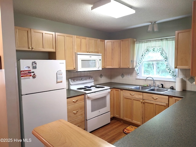 31 Mulberry Ln, New Bern, NC 28562 - kitchen with white appliances, light brown cabinetry, dark countertops, tasteful backsplash, and a textured ceiling