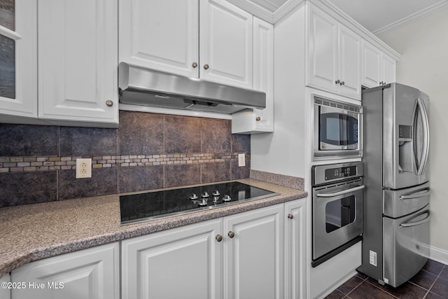 120 Windjammer Dr, Surf City, NC 28445 - kitchen featuring stainless steel appliances, under cabinet range hood, white cabinetry, tasteful backsplash, and ornamental molding